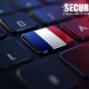French flag on a keyboard symbolizing the breach of France's government messaging platform.